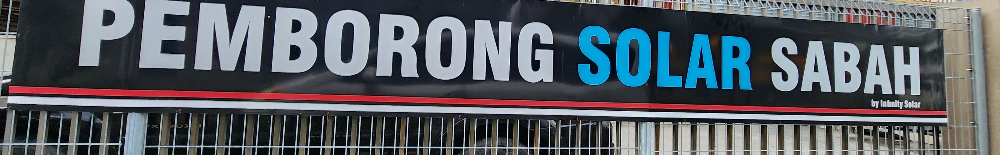 Our banner on the fence at the Inanam premises, reading Pemborong Solar Sabah.