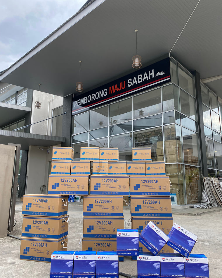 Boxed 12V 200AH batteries stacked on the forecourt at our Inanam premises.